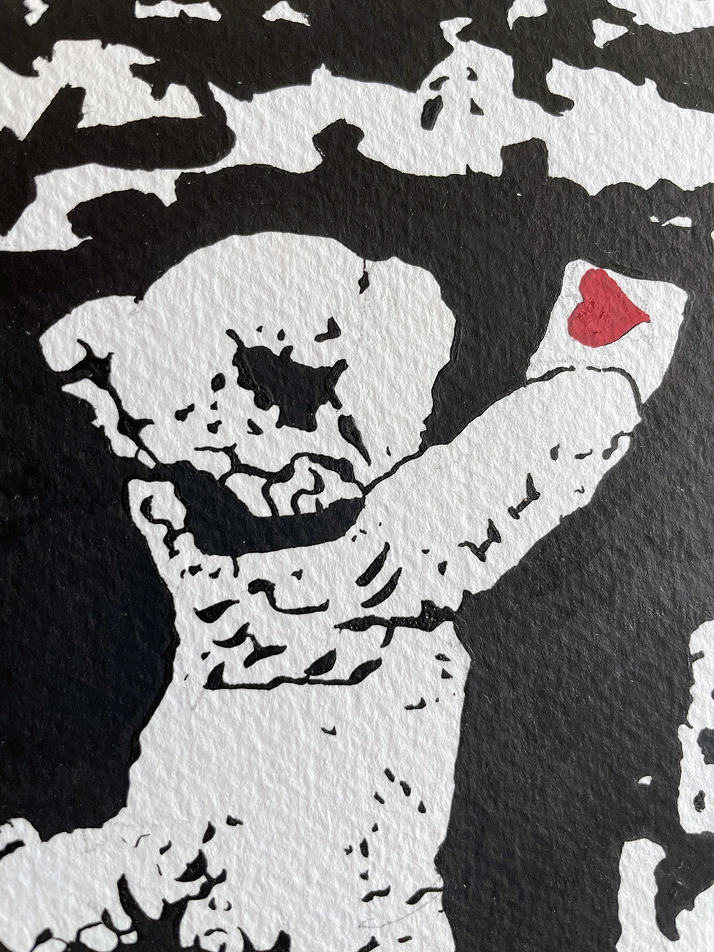 Close view of the teddy bear holding the heart note